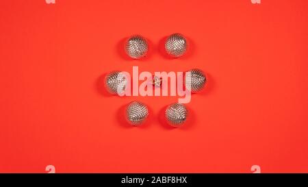 New Years balls and gift. Flat lay of Christmas balls in the form circle. Top view Stock Photo