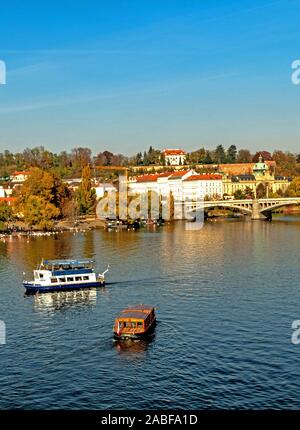 A view across the river Vitava from the Charles Bridge in Prague in the Czech Republic Stock Photo
