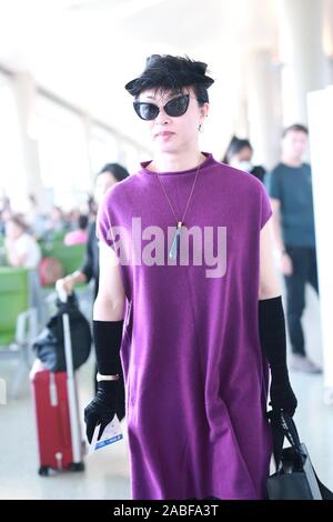 Chinese ballerina, modern dancer, choreographer, actress and transsexual celebrity arrives at Shanghai Hongqiao Airport before departure in Shanghai, Stock Photo