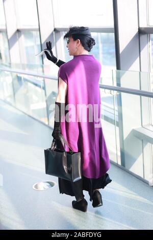 Chinese ballerina, modern dancer, choreographer, actress and transsexual celebrity arrives at Shanghai Hongqiao Airport before departure in Shanghai, Stock Photo