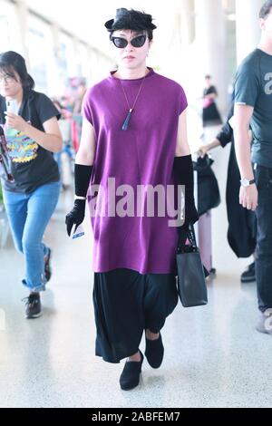 Chinese ballerina, modern dancer, choreographer, actress and transsexual celebrity arrives at Shanghai Hongqiao Airport before departure in Shanghai, Stock Photo