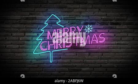 Merry Christmas shiny neon lamps sign glow on black brick wall. colorful sign board with text Merry Christmas and Christmas tree for party decoration Stock Photo