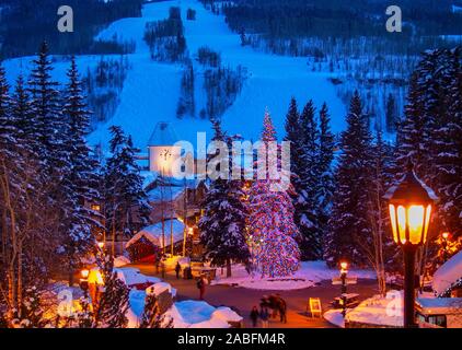 Vail, Colorado; view of the town at dusk, Gore Creek Covered Bridge Stock Photo