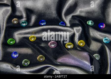 colored glass stones on a black background. looks like a starry night sky Stock Photo