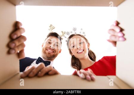 happy couple opening christmas gift box Stock Photo