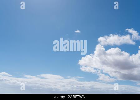 beautiful blue sky with white clouds on sunny day background Stock Photo