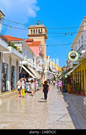 A view along Lithostroto, the main shopping street in the centre of the capital town, Argostoli.A mix of modern shops,old cafés & traditional churches. Stock Photo