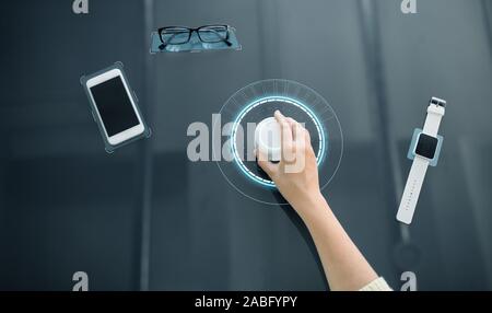 hand with control knob on interactive panel Stock Photo