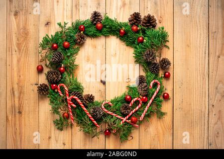 Christmas - Pine cones and branches  On the wood - Stock Photo