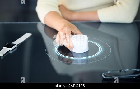 woman with control knob on interactive panel Stock Photo