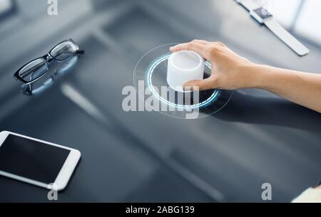 hand with control knob on interactive panel Stock Photo