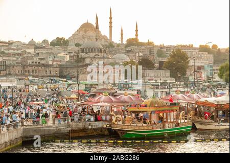 Waterfront at Eminonu with the Rustem Pasha Mosque on the skyline, Istanbul, Turkey Stock Photo