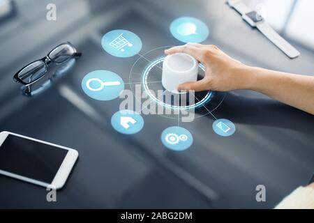 hand with app icons on interactive panel Stock Photo