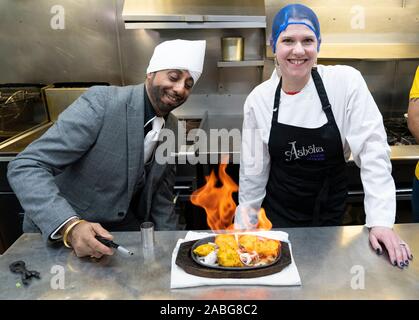 Bearsden, Scotland, UK. 27th November 2019.  Liberal Democrat leader Jo Swinson visits the Ashoka restaurant kitchen and is given cooking lessons by the chefs. She warned about the threat Brexit poses to small businesses. Iain Masterton/Alamy Live News. Stock Photo