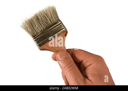 Hand holding paint brush, Stock image