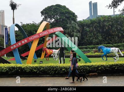 (191127) -- HONG KONG, Nov. 27, 2019 (Xinhua) -- Citizens walk at a park in Hong Kong, south China, Oct. 29, 2019. The number of visitor arrivals to Hong Kong has witnessed the sharpest decline in 16 years for the third quarter of 2019 over continued unrest in the region, official data showed Wednesday. TO GO WITH:Hong Kong records biggest visitor decline in 16 years in Q3 (Xinhua/Zhu Xiang) Stock Photo