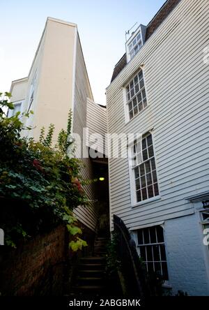 An unusual timber clad home built on Cobourg Place around and over the steps of the footpath from Hastings old town Stock Photo