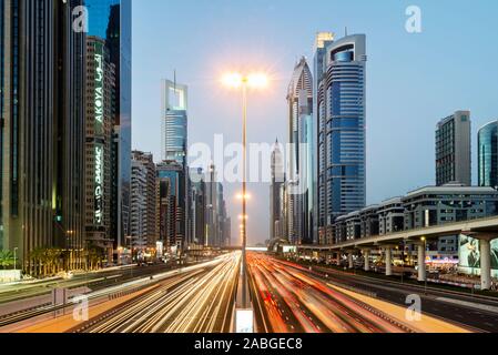 Dusk view of traffic and skyscrapers on Sheikh Zayed Road in Dubai United Arab Emirates Stock Photo