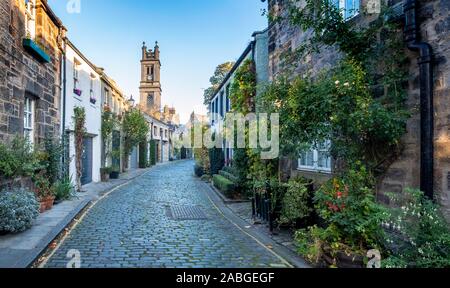 View along traditional row of mews houses towards St Stephen's Church in Circus Lane in Stockbridge district of New Town in Edinburgh, Scotland, Unite Stock Photo