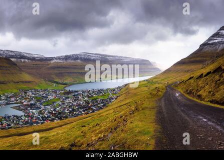 City of Klaksvik with a dirt road on Faroe Islands, Denmark Stock Photo