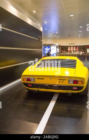 Bologna airport, Italy - June 16, 2014: yellow vintage Lamborghini Miura SV car on exhibition in Bologna airport. Rear mid-engined car produced Stock Photo