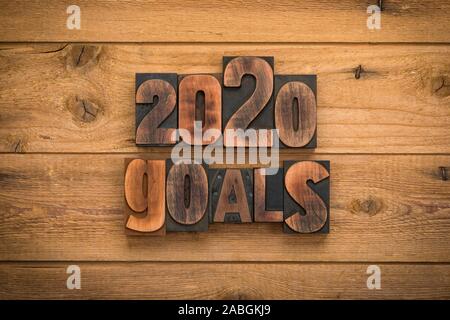 2020 goals, phrase written with vintage letterpress printing blocks on rustic wood background. Stock Photo