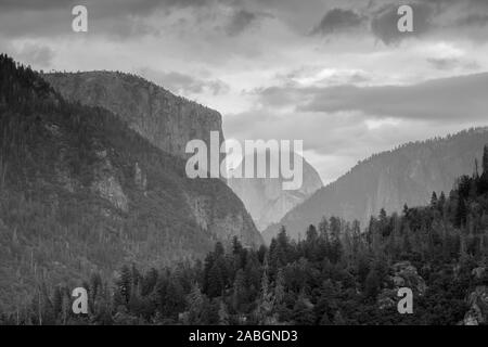 Half Dome peaking its head out over the top of the mountains Stock Photo