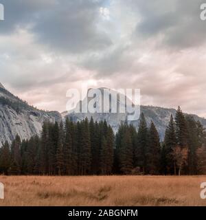 Dramatic sky over Half Dome from Cook's Meadow Stock Photo