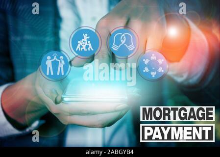 Writing Note Showing Mortgage Payment Business Concept For Periodic Amount Paid To A Holder For Repayment Of A Loan Stock Photo Alamy