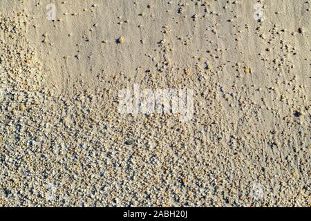 Transition on beach from fine sea sand to coarse beach sand grains Stock Photo