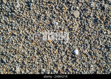 Close-up of coarse sea sand grains on beach Stock Photo