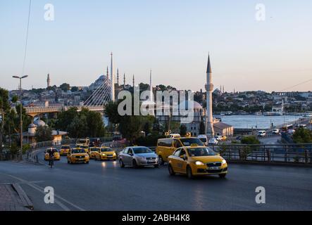 Istanbul, Turkey: daily life, a row of taxis in city traffic with view on the Golden Horn and Suleymaniye mosque, famous Ottoman imperial mosque Stock Photo