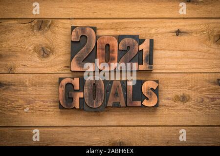2021 goals, phrase set with vintage letterpress printing type on rustic wooden background Stock Photo