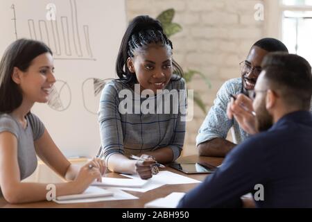 Successful mixed race group of managers working together at office. Stock Photo