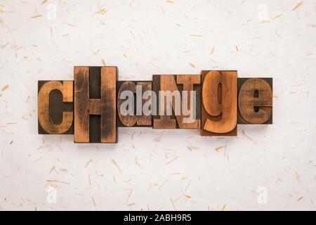 change, word written with vintage letterpress printing blocks on textured paper background Stock Photo
