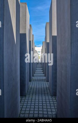 Berlin, Germany - April 20, 2019 - Depressive view among the concrete stelae at Memorial to Murdered Jews of Europe (Holocaust Memorial), a memorial i Stock Photo