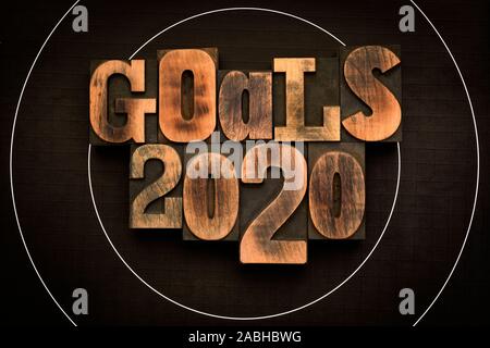 Goals 2020, phrase written with vintage letterpress printing blocks on archery target Stock Photo