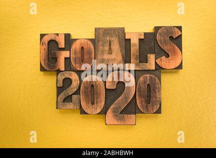 Goals 2020, phrase written with vintage letterpress printing blocks on gold colored background Stock Photo