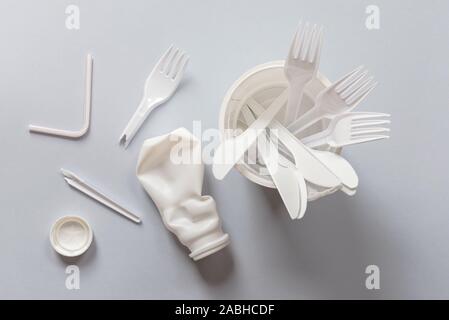 Used white plastic for food on a gray background Stock Photo