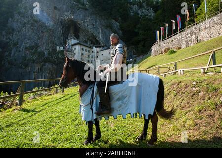 Predjama, Slovenia, July 27, 2008: A mounted knight outside the Predjama castle during a Medieval reenactment event in 2008. Stock Photo