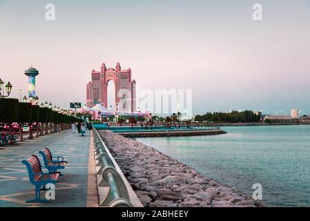 Abu Dhabi, United Arab Emirates - November 2, 2019: Al Marina island walking path by the seaside in Abu Dhabi at sunset Stock Photo