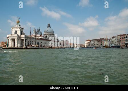 Venice, Italy: Basilica di Santa Maria della Salute und Punta della Dogana, view from a boat into the Grand Canal Stock Photo