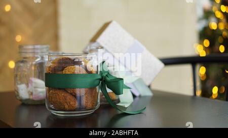 Healthy cookies with dried fruits and nuts in a glass jar. Christmas time Stock Photo