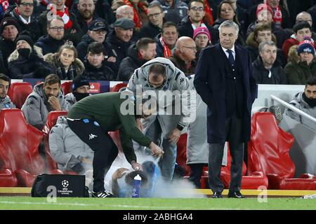 Liverpool, UK. 27th Nov, 2019. Napoli Manager Carlo Ancelotti (r) looks on as Giovanni Di Lorenzo of Napoli receives treatment. UEFA Champions league group E match, Liverpool v Napoli at Anfield Stadium in Liverpool on Wednesday 27th November 2019. this image may only be used for Editorial purposes. Editorial use only, license required for commercial use. No use in betting, games or a single club/league/player publications. pic by Chris Stading/Andrew Orchard sports photography/Alamy Live news Credit: Andrew Orchard sports photography/Alamy Live News Stock Photo