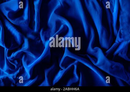 Luxury silk fabric of classic blue color, abstract background image Stock Photo