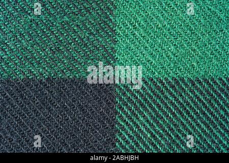 Black and Green Fabric in a Cage. Blanket Material. Clothes Background Stock Photo