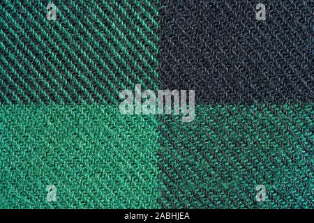 Black and Green Fabric in a Cage. Blanket Material. Clothes Background Stock Photo