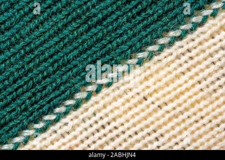 Green and white knitting wool texture. Cloth background close up Stock Photo