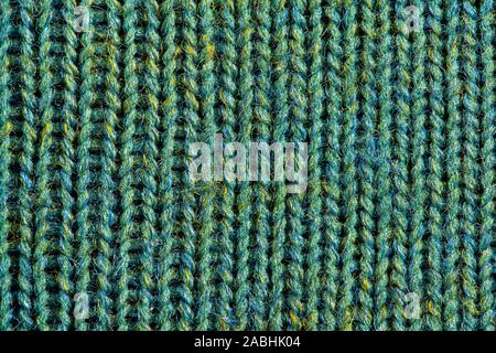 Green knitting wool texture. Cloth background close up Stock Photo
