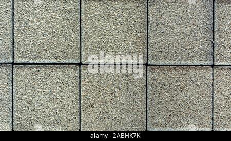 Brick pavement tile, top view. Urban texture as background. Stone pavement texture. Granite cobblestoned pavement background. closeup Stock Photo